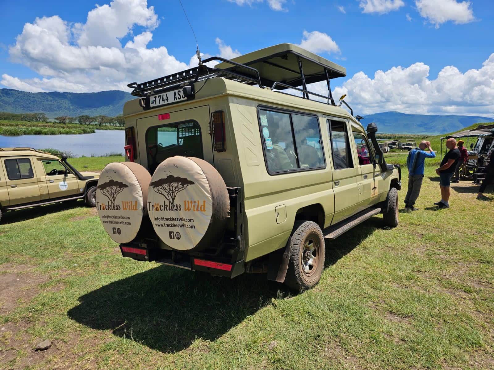 Our vehicle on the Ngorongoro crater floor, lake and crater wall behind